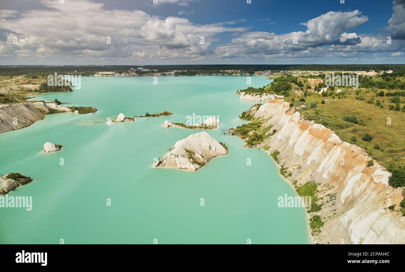Green water in mine pit aerial above top view Stock Photo