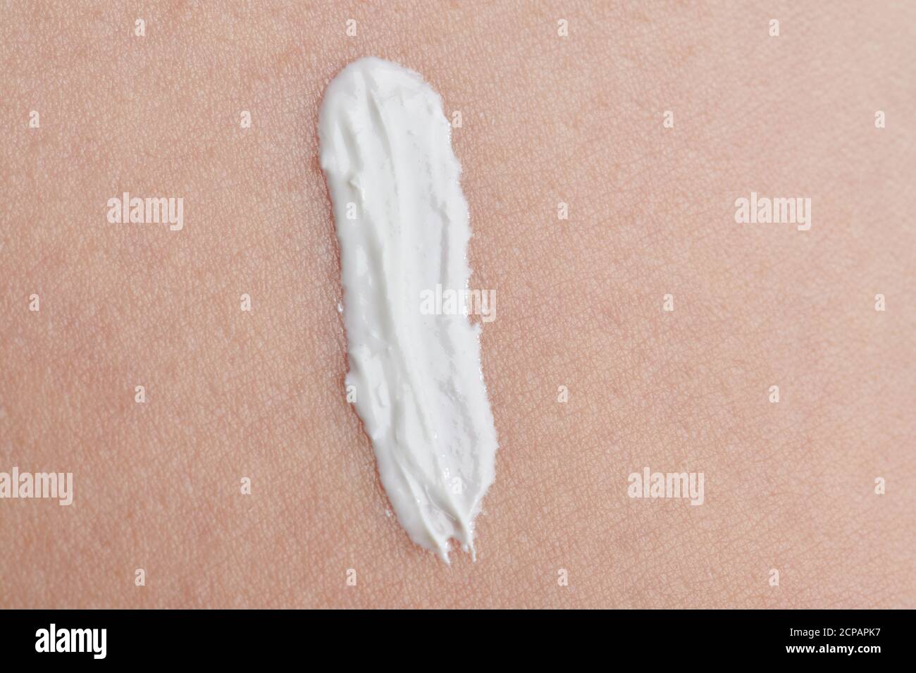 White skin cream line on clean baby face background Stock Photo