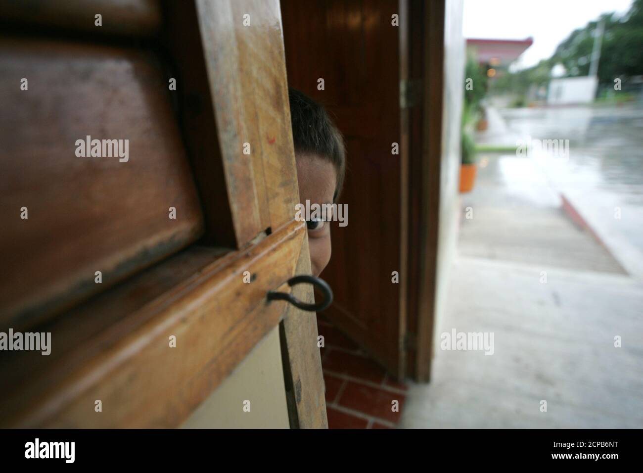 A child watches from a shelter after being evacuated in ...