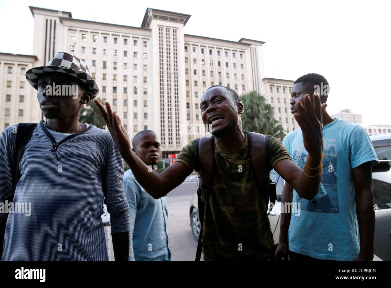 A man reacts after hearing the announcement by Congo's election board to postpone a presidential vote scheduled for Sunday by one week, outside the the Congo's National Independent Electoral Commission (CENI) building in Kinshasa, Democratic Republic of Congo, December 20, 2018.REUTERS/Baz Ratner Stock Photo