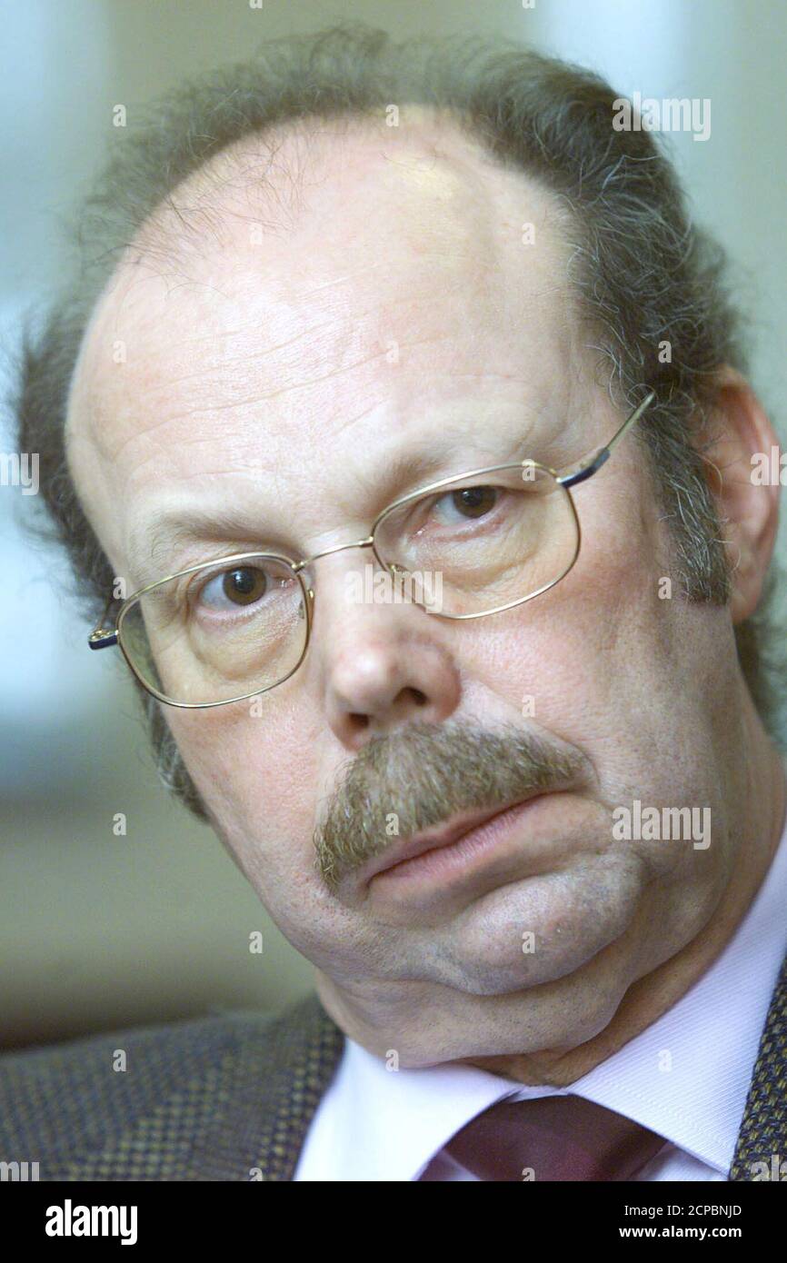 Hugo Van Damme, chief executive officer of Belgian electronics firm Barco,  looks on during a news conference in Kortrijk February 8, 2002. Van Damme  said he will seek early retirement. He will