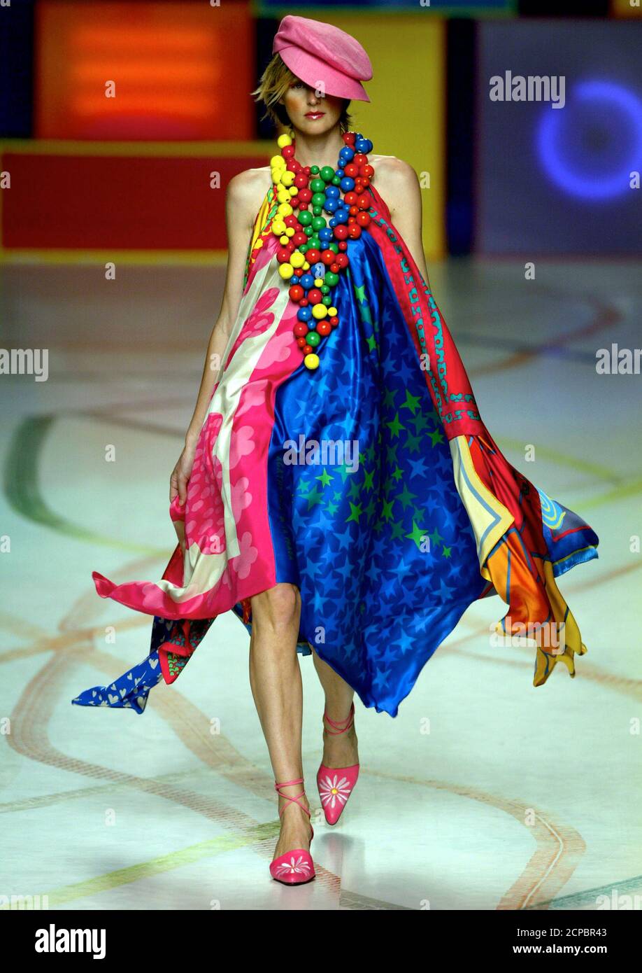 British model Stella Tennant displays an outfit created by designer Agatha  Ruiz de la Prada during the Spring/Summer 2004 Pasarela Cibeles fashion  week in Madrid September 24, 2003. The Pasarela Cibeles will