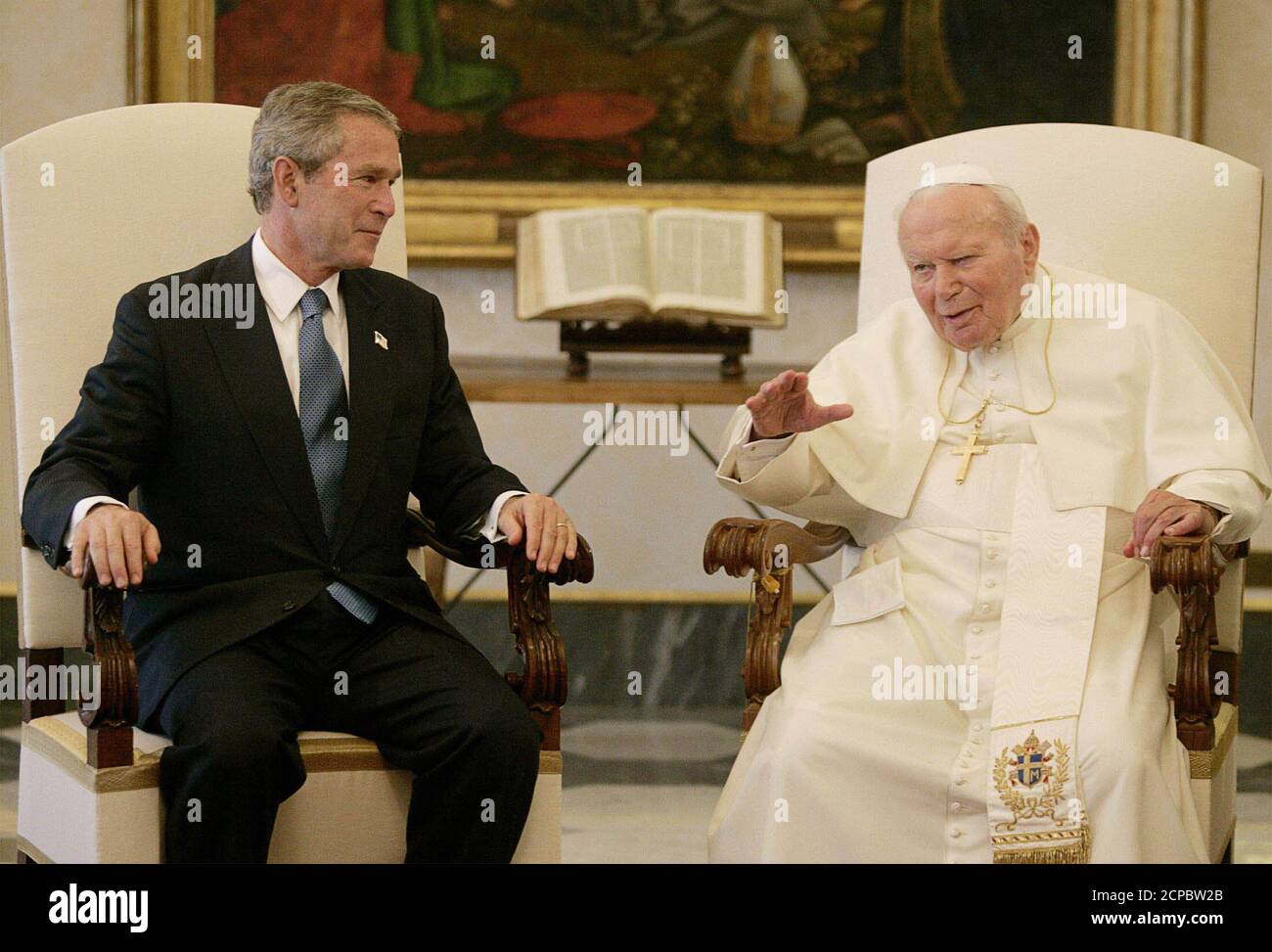 U.S. President George W. Bush listens to Pope John Paul II at the Vatican  in this June 4, 2004 file photo. John Paul neared death April 1, 2005 as  his health suddenly