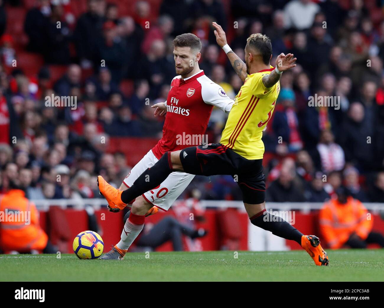 Soccer Football - Premier League - Arsenal vs Watford - Emirates Stadium, London, Britain - March 11, 2018   Arsenal's Shkodran Mustafi in action with Watford's Roberto Pereyra     REUTERS/Eddie Keogh    EDITORIAL USE ONLY. No use with unauthorized audio, video, data, fixture lists, club/league logos or 'live' services. Online in-match use limited to 75 images, no video emulation. No use in betting, games or single club/league/player publications.  Please contact your account representative for further details. Stock Photo