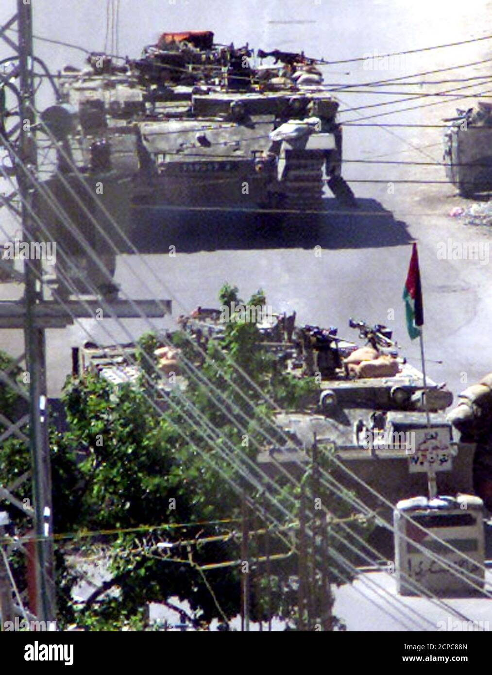 Israeli tanks roll into Hebron in the West Bank April 29, 2002. Israeli