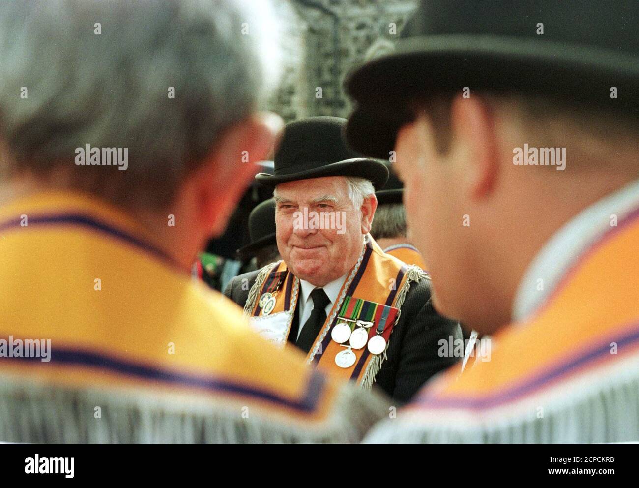 An Orangeman smiles as he talks to his brethren at the Parade from Drumcree church to the barrricade July 13. The stand off between loyalists and security forces at Drumcree is on its ninth day.  DC/FMS Stock Photo