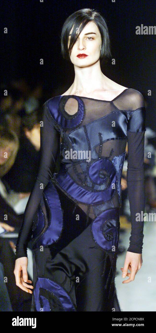 Erin wears a black and navy floor-length collage applique swirl dress at Donna Karan's fall and winter fashion show in New York, February 15, 2002. REUTERS/Ray Stubblebine  RFS/HK Stock Photo