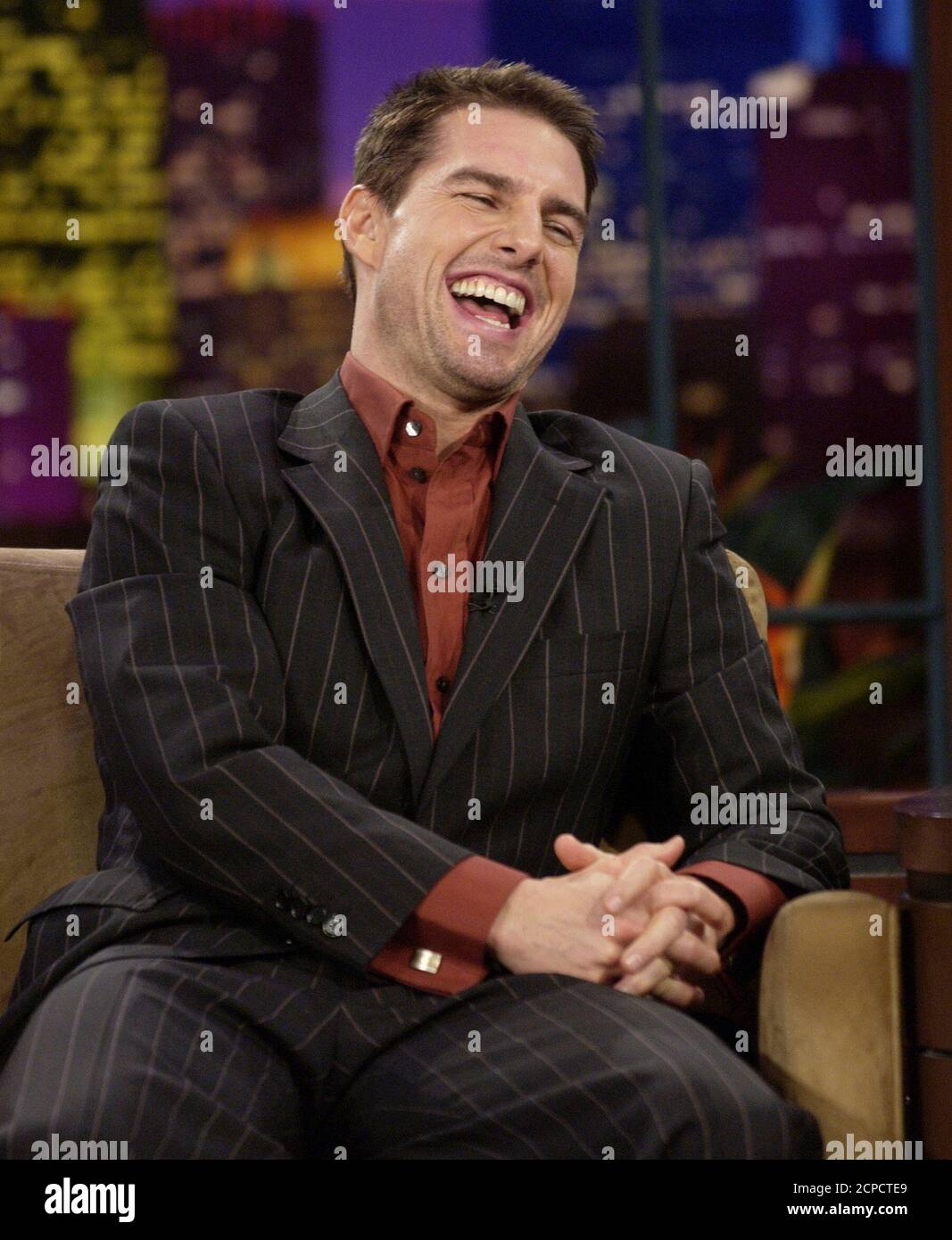 Actor Tom Cruise appears on 'The Tonight Show with Jay Leno,' at NBC's studios in Burbank, California August 9, 2004. Crime may not pay for Tom Cruise. The box office superhero's first outing as a villain, in director Michael Mann's thriller 'Collateral,' made off with a middling $24.4 million during its first three days at the North American box office, according to studio estimates issued on August 8, 2004. It represents the second-smallest No. 1 debut for the summer of 2004. Cruise portrays contract killer Vincent in the movie. REUTERS/Jim Ruymen  JR Stock Photo