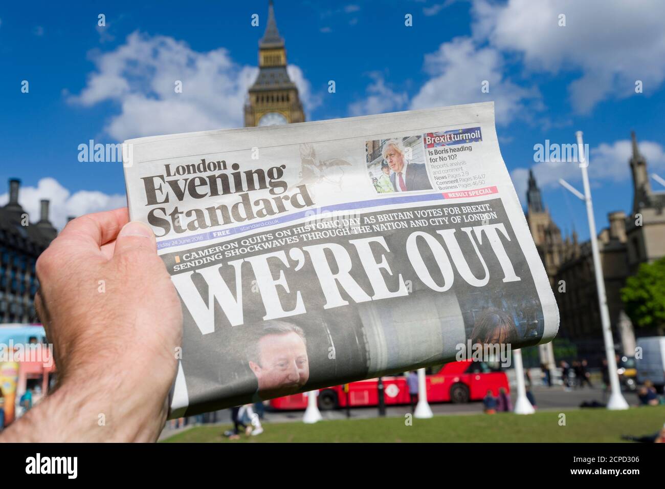 A London Evening Standard Newspaper, with the headline ‘We’re Out’ after Britain voted to leave the European Union, in yesterdays referendum, being held up in front of Houses of Parliament, Parliament Square, Westminster, London, UK.  24 Jun 2016 Stock Photo