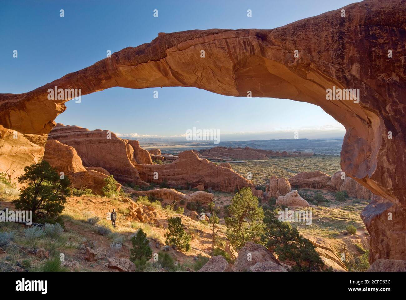 Hiker below landscape arch hi-res stock photography and images - Alamy