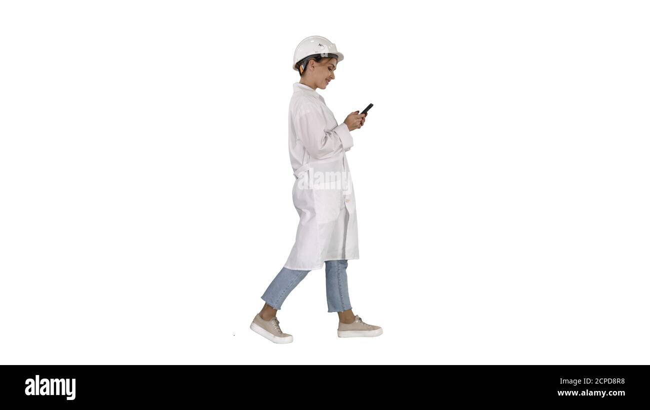 Female Scientist Using Smartphone Walking on white background. Stock Photo