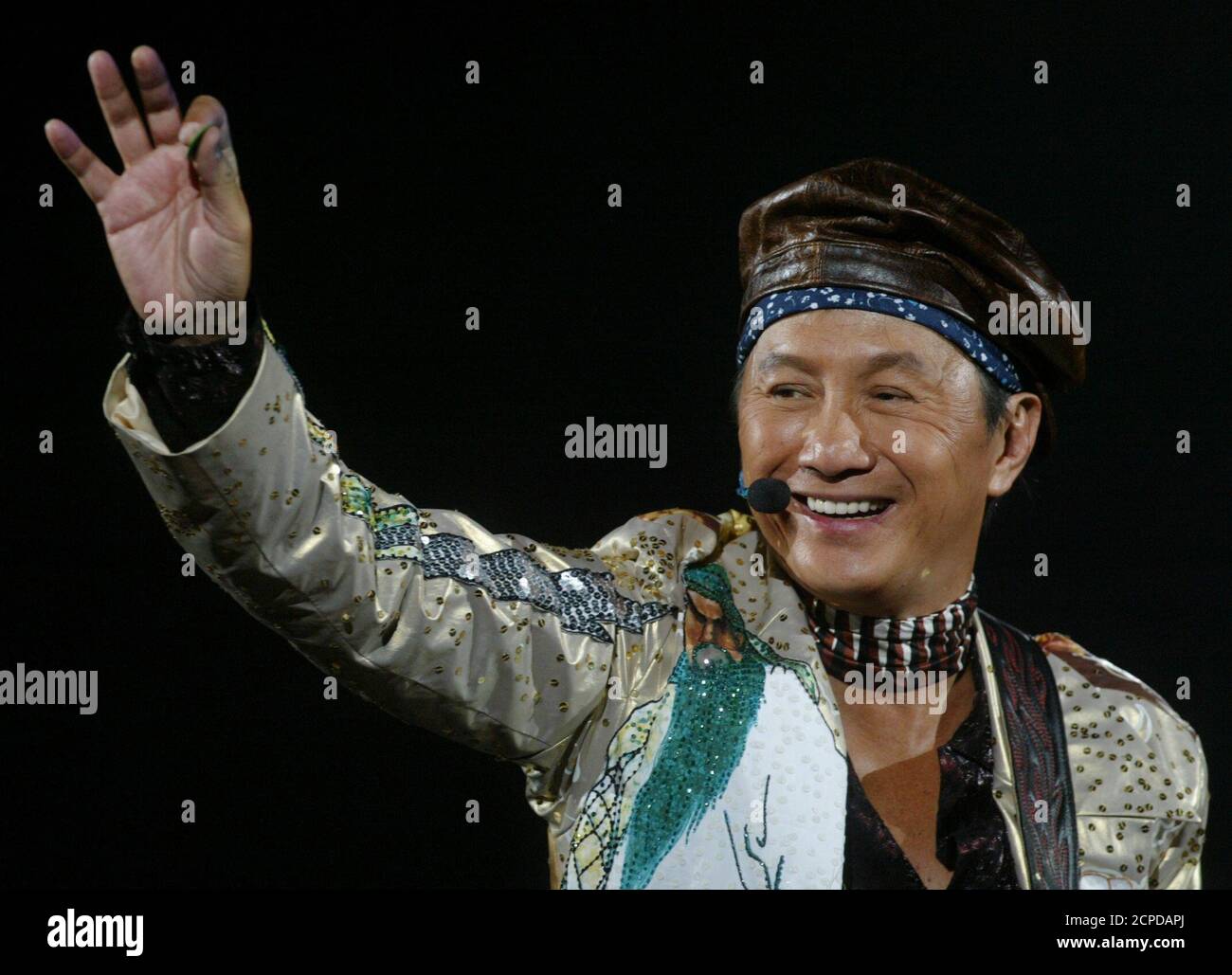 Hong Kong singer-actor Sam Hui holds his first concert after retiring for a decade in Hong Kong, June 5, 2004. Hui was Hong Kong's most popular cantopop singer and comic actor in Chinese communities around the world in the 1970s. REUTERS/Kin Cheung  KC/CP Stock Photo