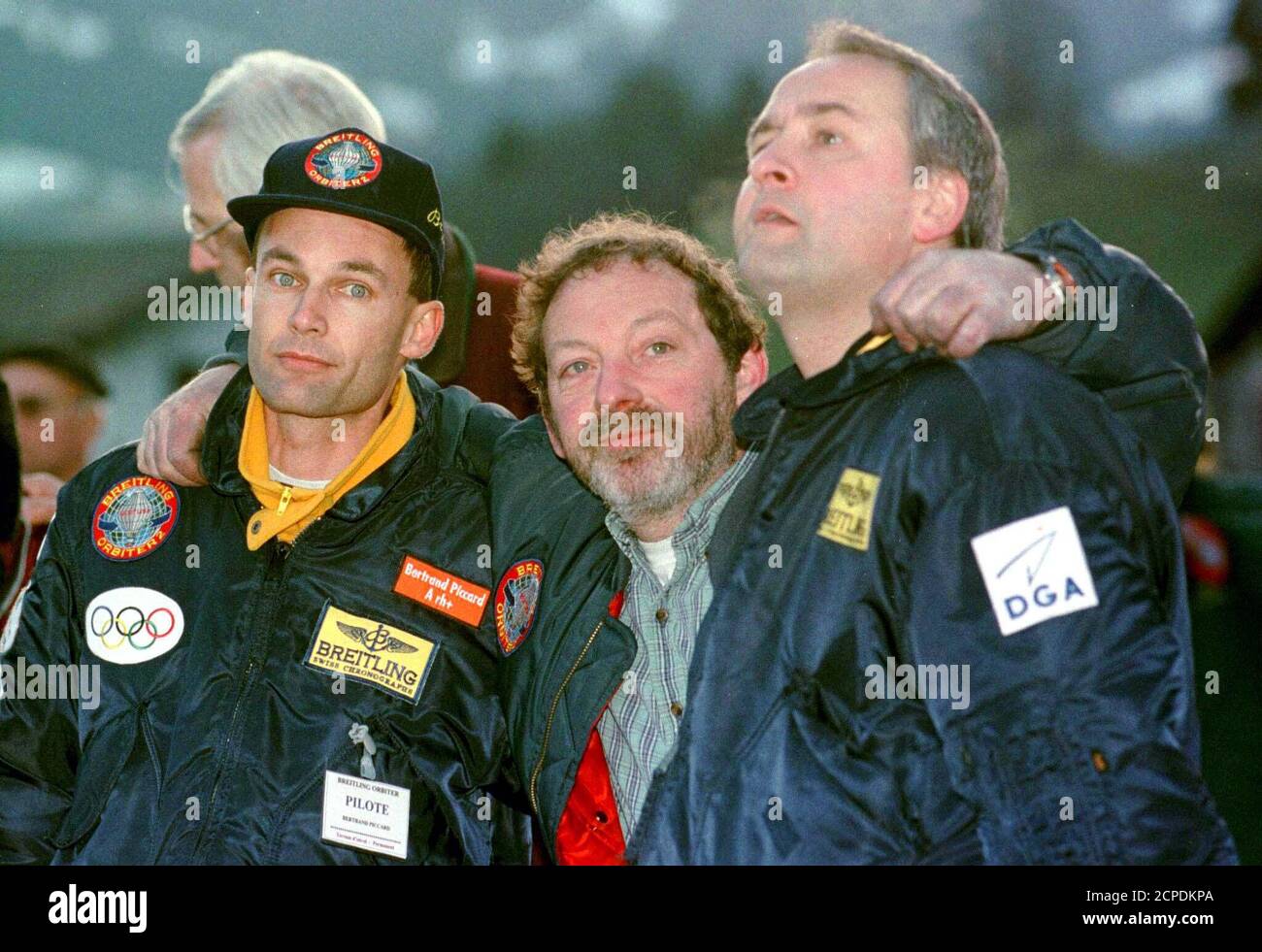 Balloonists and adventurers Bertrand Piccard from Switzerland (L),  Britain's Andy Elson (C) and Belgian Wim Verstraeten show their  disappointment after the capsule belonging to Breitling Orbiter 2, a  combination of hot air