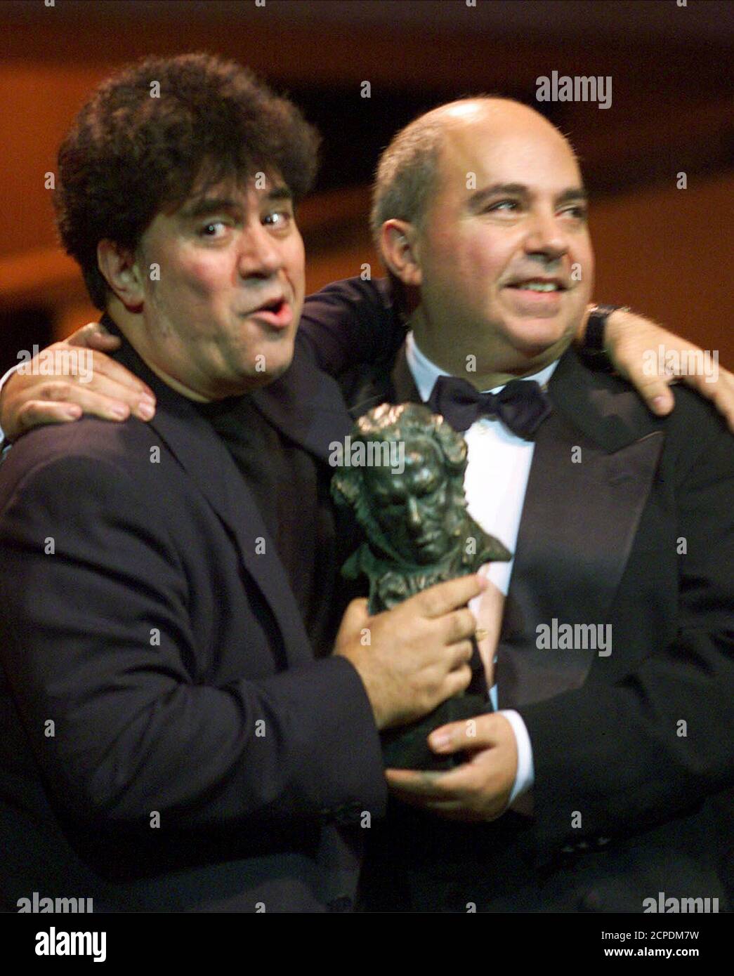 Director Pedro Almodovar and his brother Agustin (R) receive the Goya prize during the Spanish Film Academy awards in Barcelona January 30. Almodovar won the prize for best director and his brother for the best film, 'Todo sobre mi madre' (All About My Mother). The Goyas are the Spanish equivalent to the Oscars.  GN Stock Photo