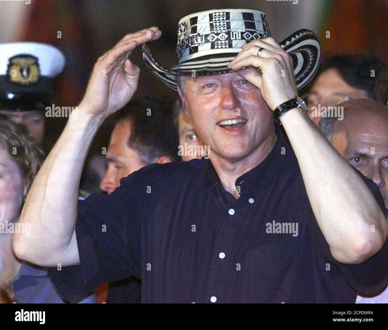 U.S. President Bill Clinton tries on a 