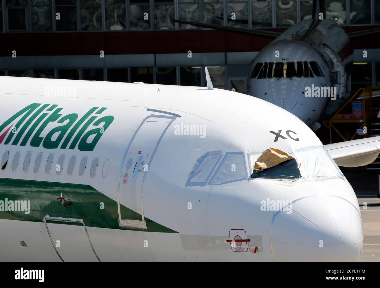 An Alitalia airplane is seen outside a hangar at Leonardo da Vinci airport  in Fiumicino, August 8, 2014. Italy's flagship carrier Alitalia said on  Friday it had reached a deal with trade