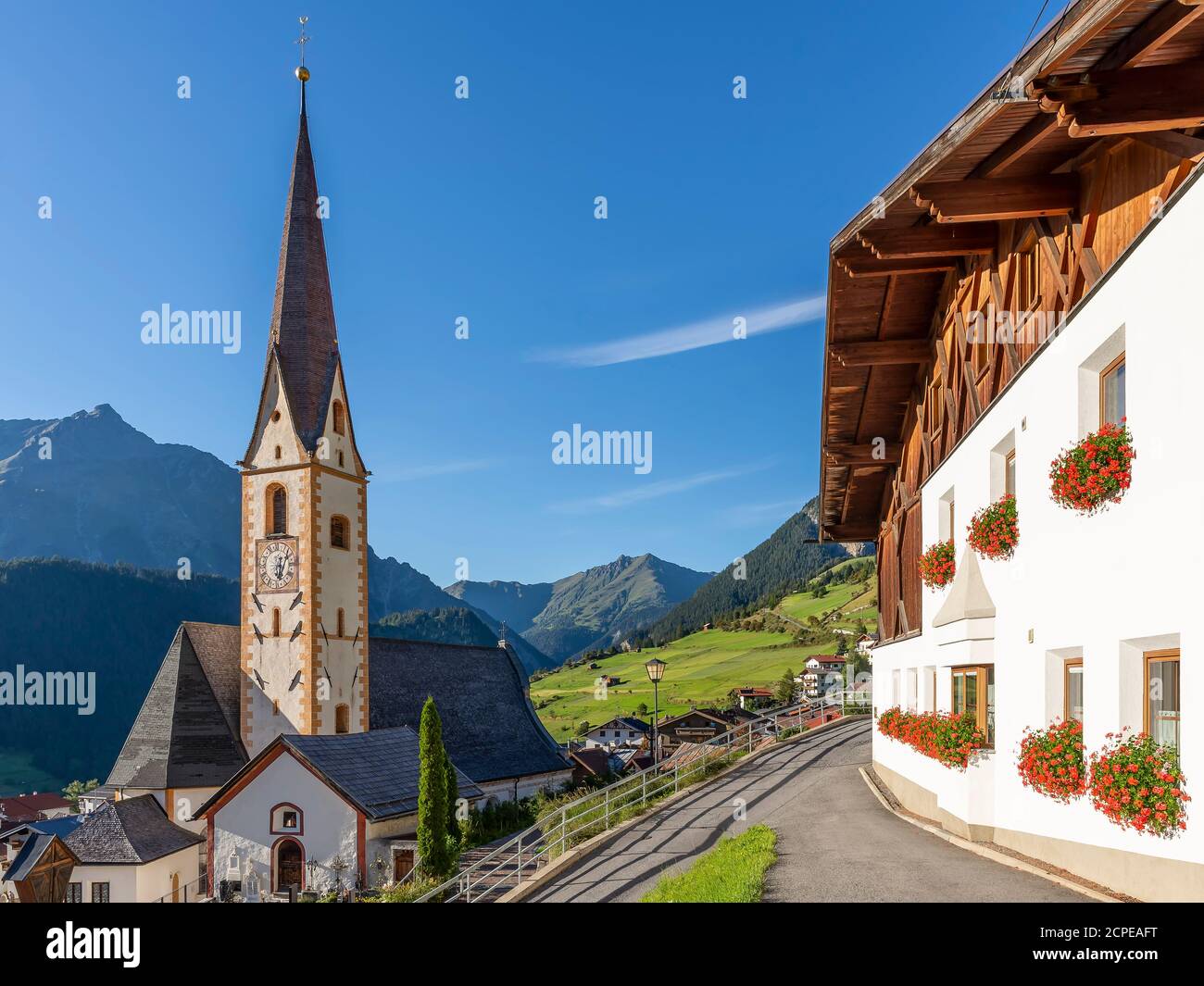 The historic center and parish church of Nauders in the Austrian Tyrol, near the border with Italy Stock Photo