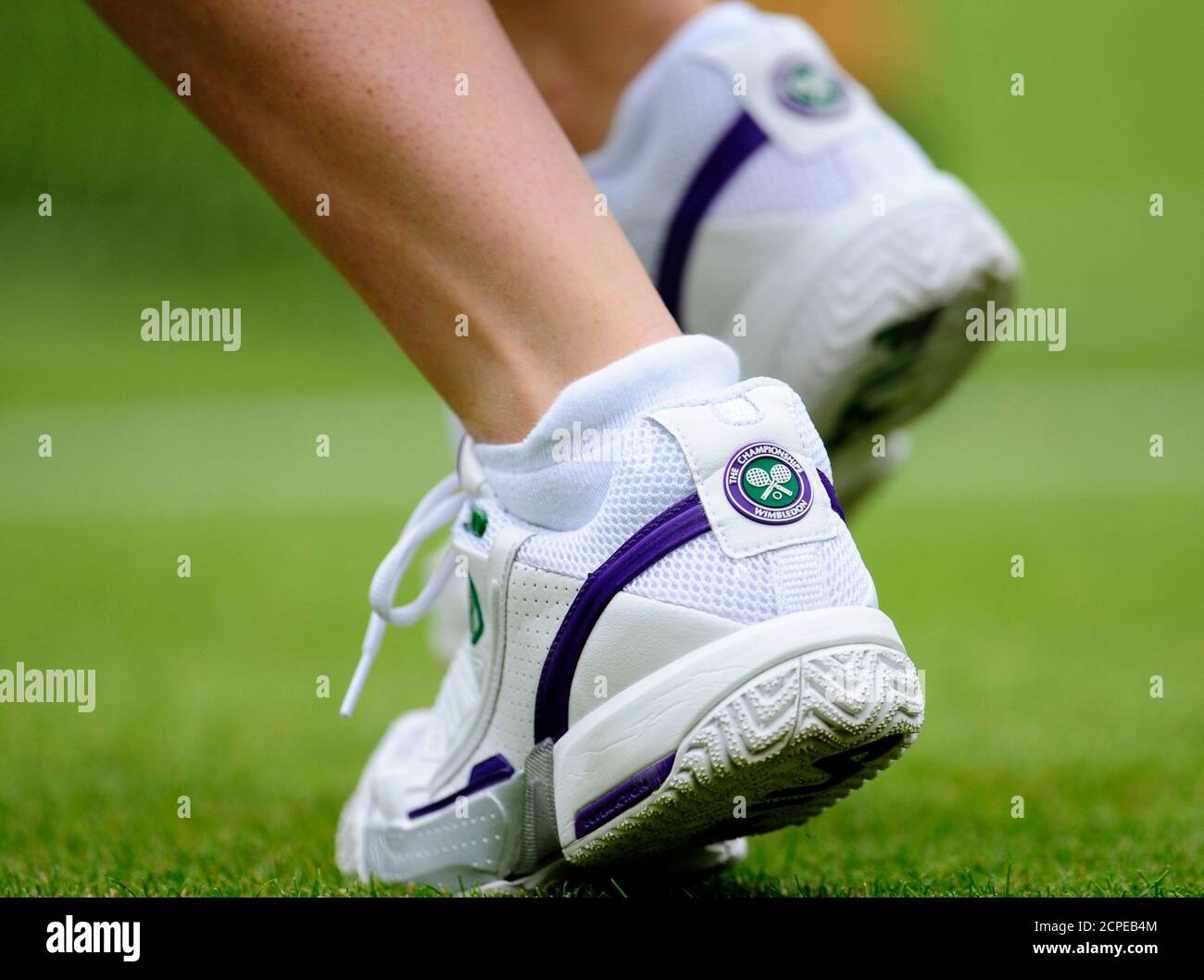 The shoes of ball girl are seen during the match between Maria Sharapova of  Russia and Viktoriya Kutuzova of Ukraine at the Wimbledon tennis  championships, in London June 22, 2009. REUTERS/Toby Melville (