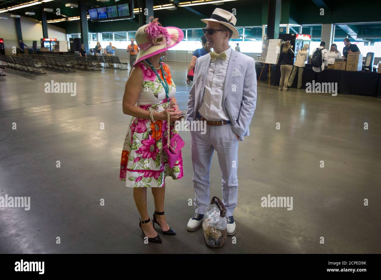 People stand inside the grandstand before the 2014 Belmont Stakes in Elmont, New York June 7, 2014. REUTERS/Carlo Allegri (UNITED STATES - Tags: SPORT HORSE RACING SOCIETY) Stock Photo