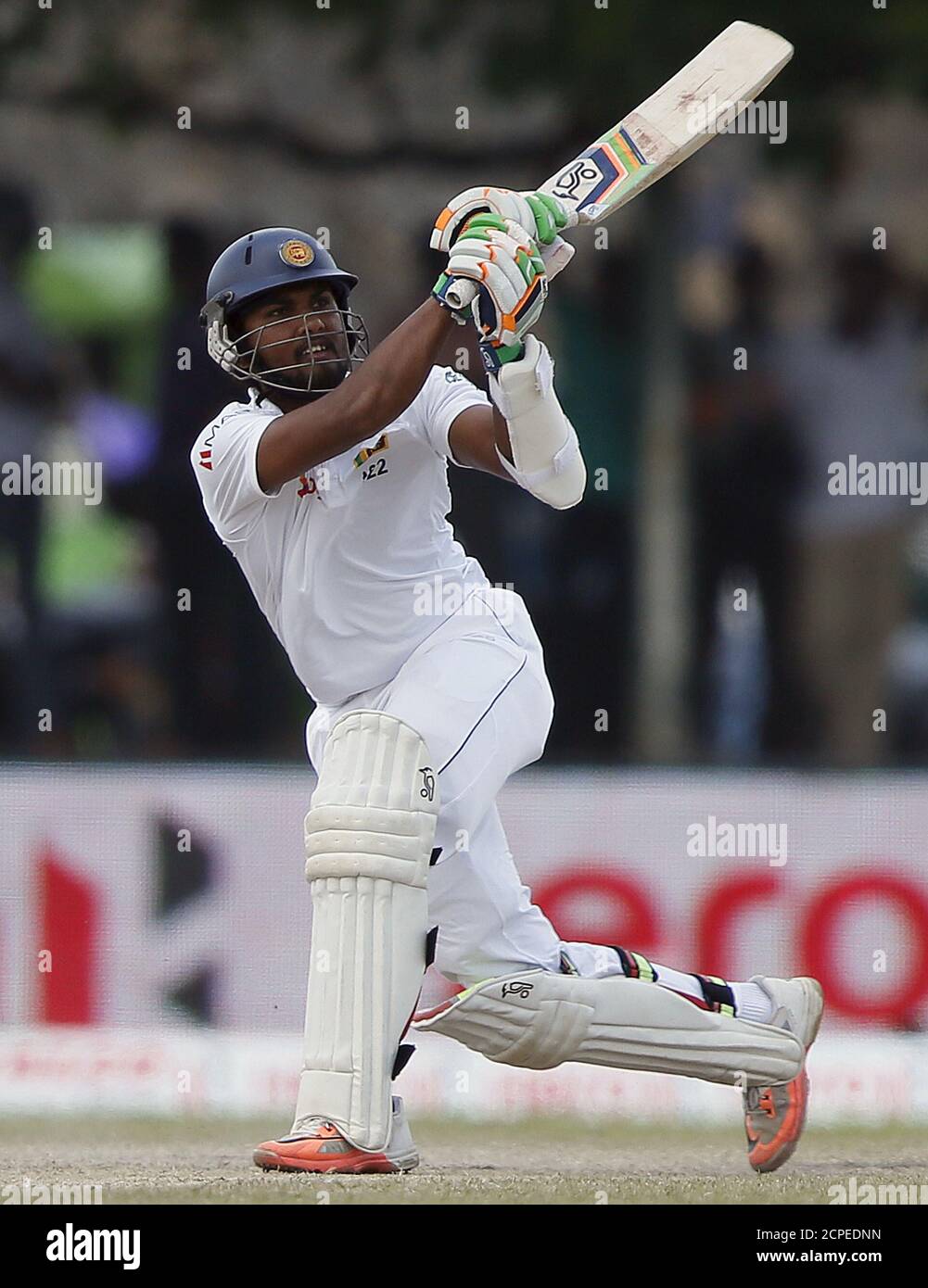 Sri Lanka's Dinesh Chandimal watches his six shot during the third day of their first test cricket match against India in Galle August 14, 2015. REUTERS/Dinuka Liyanawatte Stock Photo