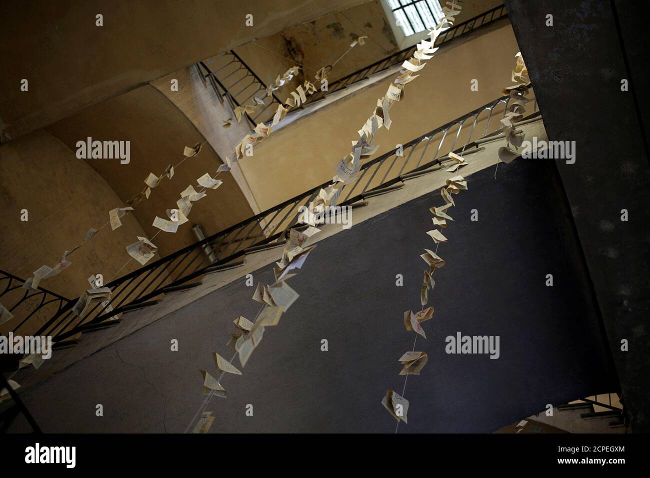 A view shows pages from books hanging at the main stairway of the Cavallerizza Reale building, which is occupied by the 'Assemblea Cavallerizza 14:45' movement in Turin, Italy, July 15, 2016. REUTERS/Marco Bello       SEARCH 'CAVALLERIZZA REALE' FOR THIS STORY. SEARCH 'WIDER IMAGE' FOR ALL STORIES. Stock Photo