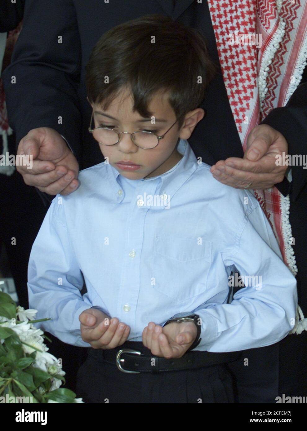 Prince Hussein, the eldest son of Jordan's King Abdullah, prays at the
