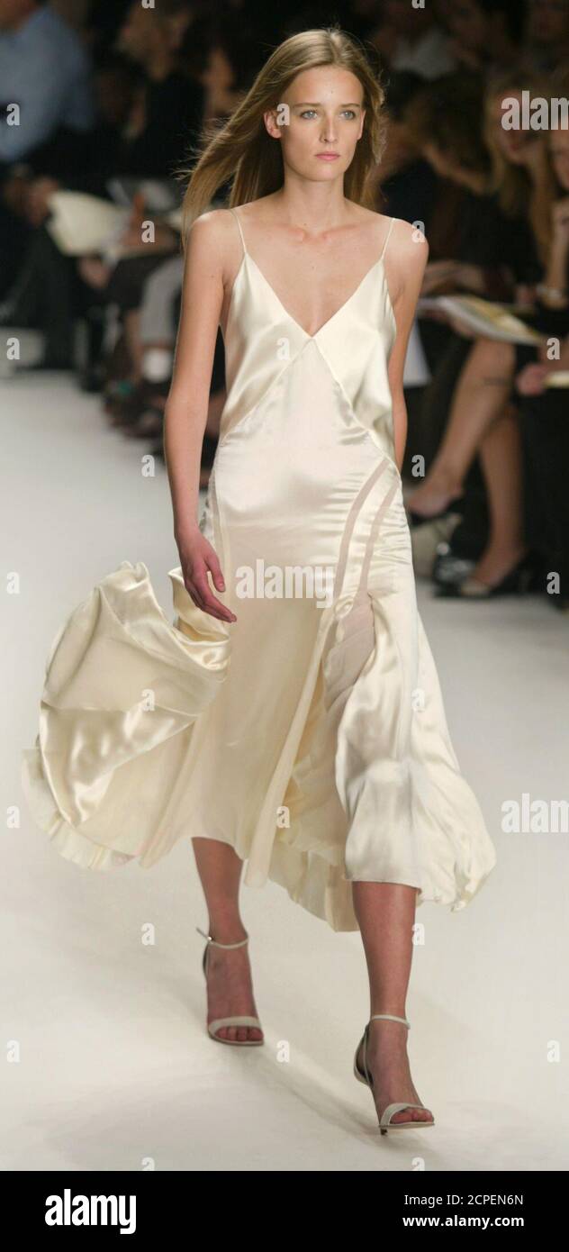 A model for Calvin Klein wears a silk satin dress during a showing of the  designers Spring 2003 collection in New York City, September 19, 2002.  REUTERS/Jeff Christensen JC Stock Photo - Alamy