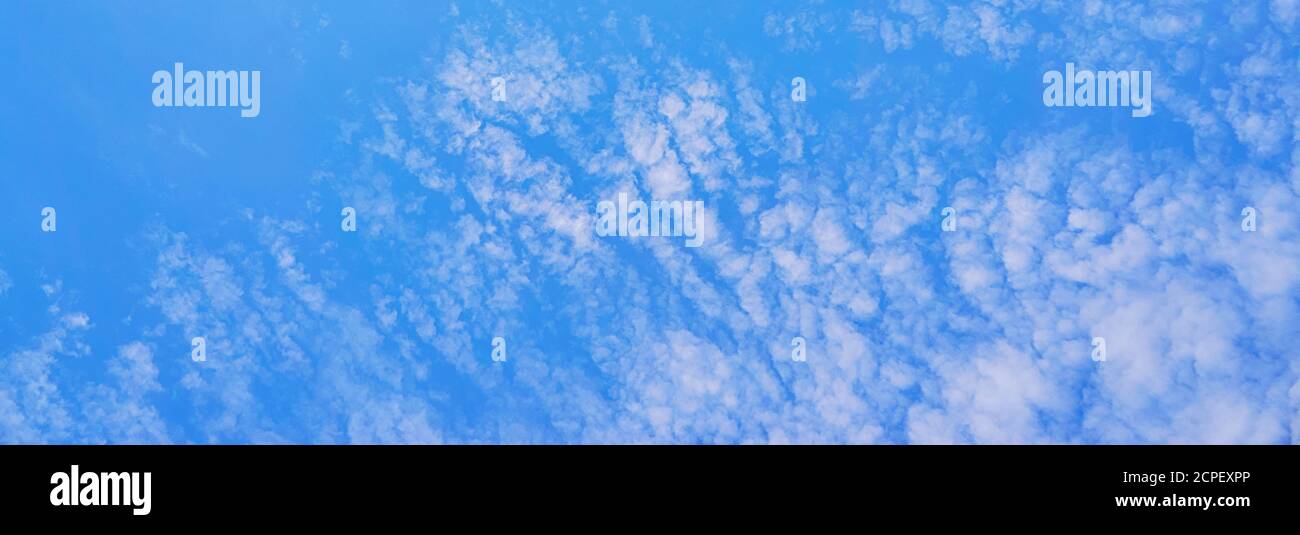 Blue sky with white clouds as a panorama background Stock Photo - Alamy