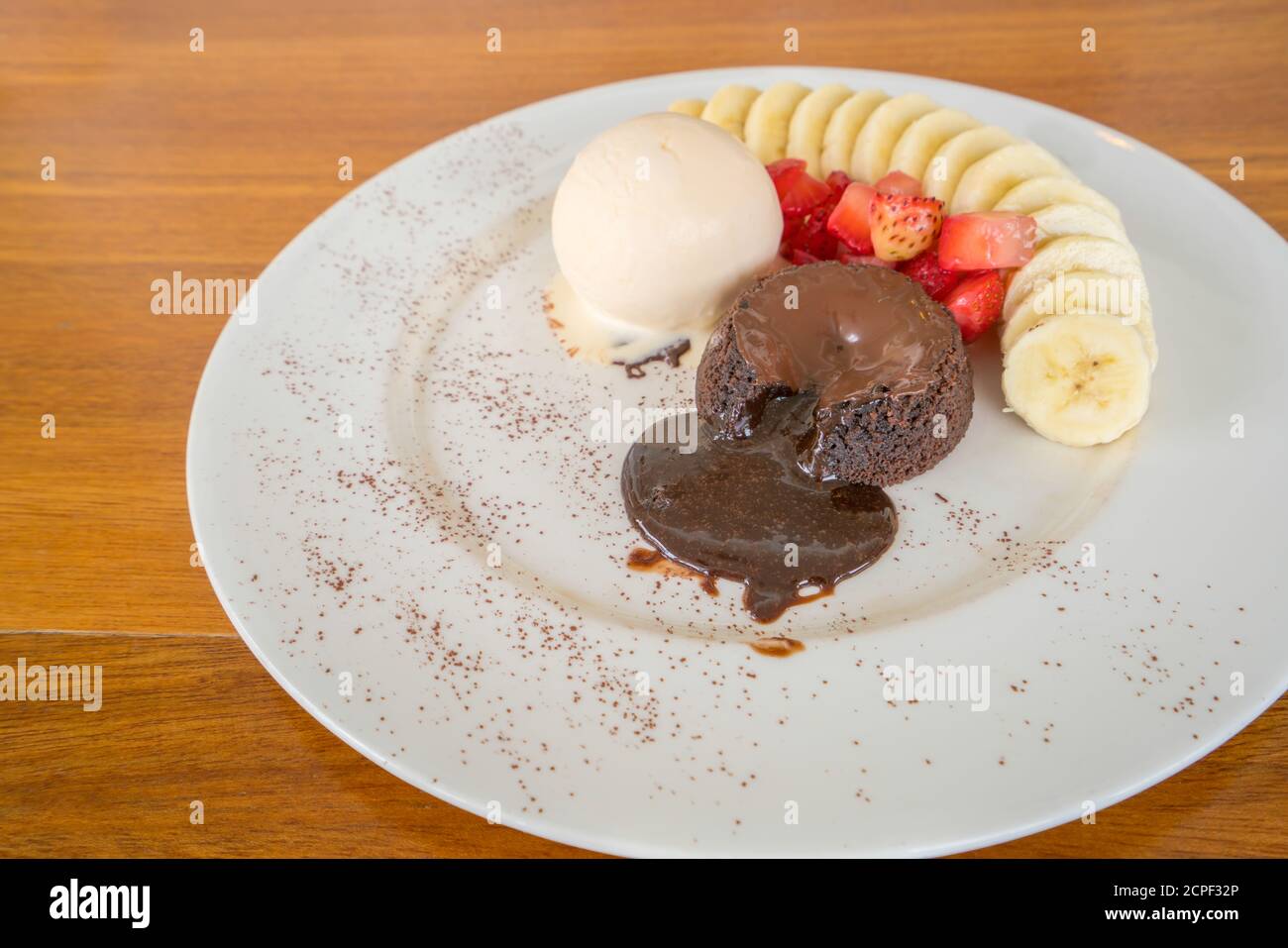 Vanilla Cake With Hot Chocolate Topping With Glazed Strawberry Chocolate Cake With Chocolate Ganache Stock Photo Stock Photo Alamy