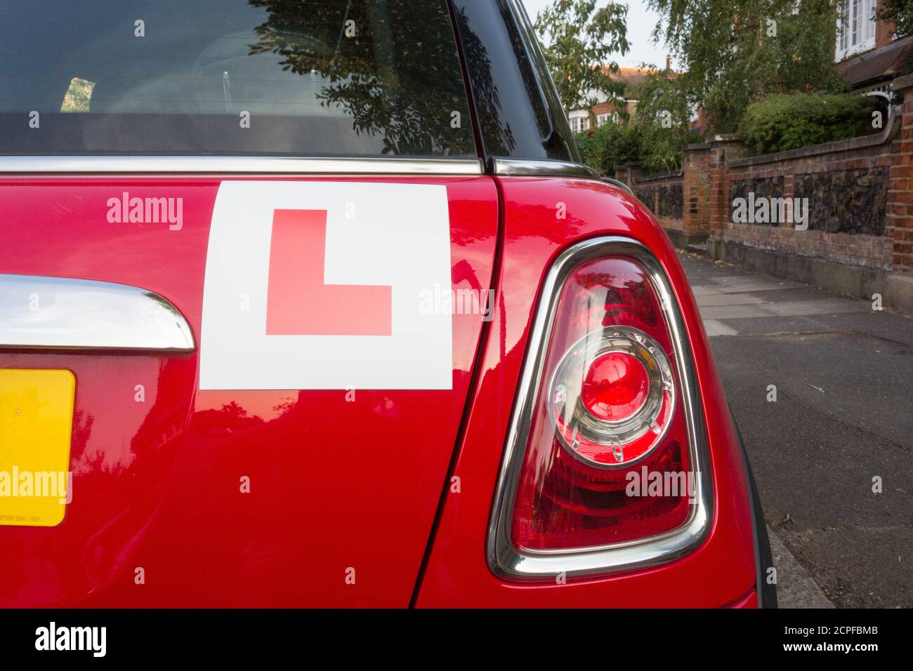 Closeup of L Plates on a red BMW Mini Cooper Hatch car Stock Photo