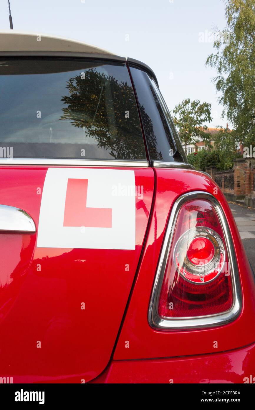 Closeup of L Plates on a red BMW Mini Cooper Hatch Stock Photo