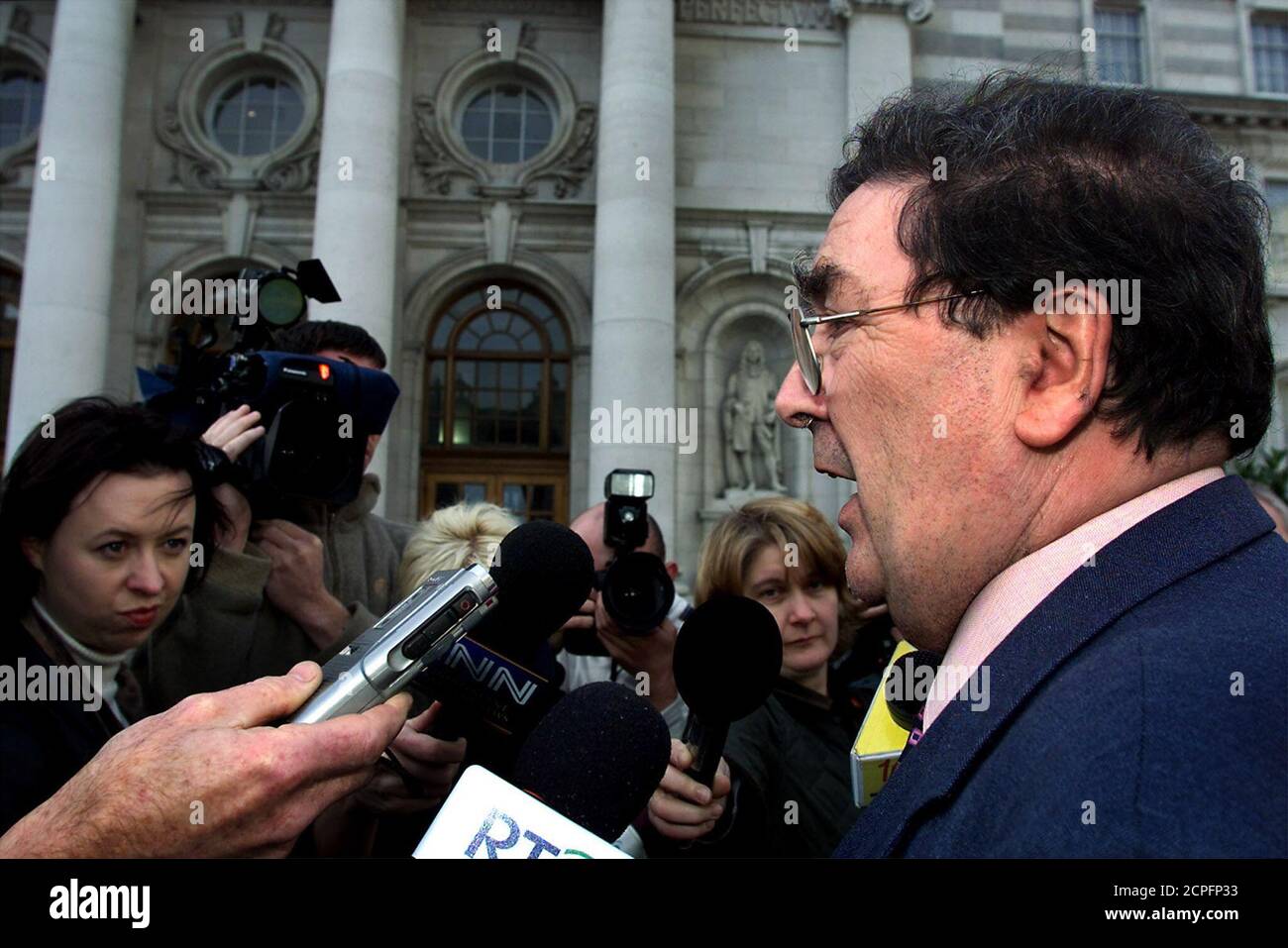 SDLP leader John Hume talks to the media outside Dublin's Government Buildings before meeting the Irish Prime Minister Bertie Ahern on December 4, 2000. Hume met the Irish Premier Ahern after announcing he was stepping down his seat in the Northern Ireland Assembly.  FP/CRB Stock Photo