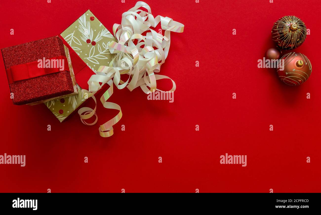 Christmas background with gift boxes and decorations on red.  Stock Photo