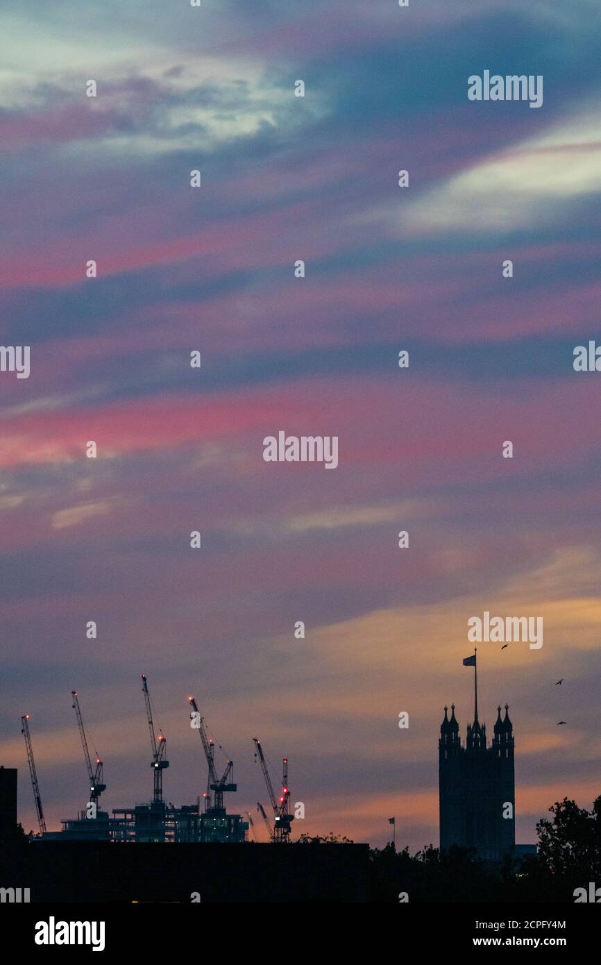 London, UK. 18th Sep, 2020. The sun sets, as the unseasonably warm weather continue, over the Victoria Tower in the Houses of Parliament - as seen from Elephant and Castle. Credit: Guy Bell/Alamy Live News Stock Photo
