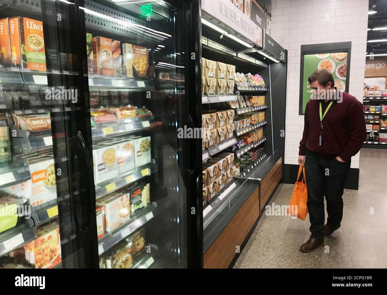 A customer browses meal-kit options at Amazon's new 'grab-and-go' store in Seattle, Washington, U.S., January 18, 2018. Photo taken January 18, 2018. REUTERS/Jeffrey Dastin Stock Photo