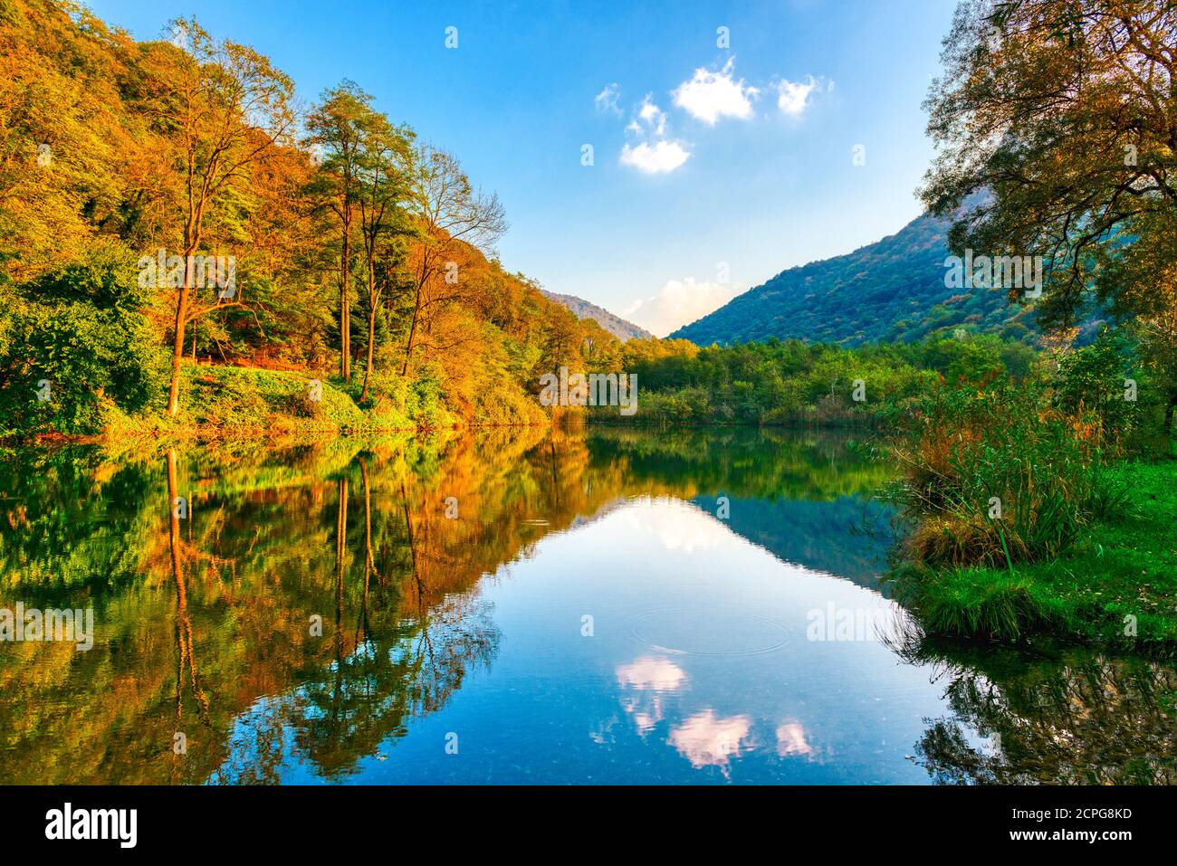 Autumn colors in the forest and lake of Brinzio near Varese city Stock Photo
