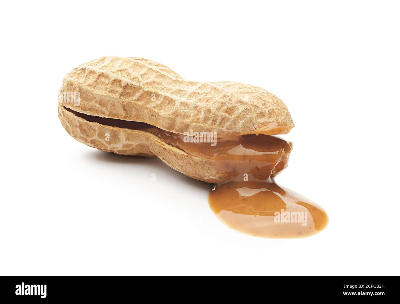 Peanut butter paste leaking from opened peanut Stock Photo Alamy