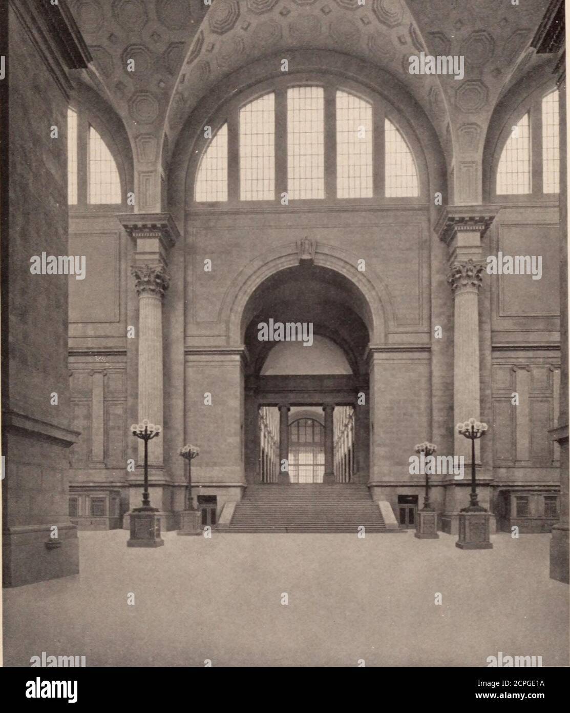 . The New York improvement and tunnel extension of the Pennsylvania railroad. Issued October, 1910 . th Street, an important crosstown thor-oughfare. Leading up from the exit concourse ofthe Station to this private street is a moving stairway. Underlying the main concourse and locatedbetween it and the tracks is the exit concourse, 60feet wide, which will be used for egress purposesonly. This exit concourse is eighteen feet above thetrain platforms and is connected with them by twostairways and one elevator from each platform. Fromthe exit concourse ample staircases and inclines leaddirectly t Stock Photo