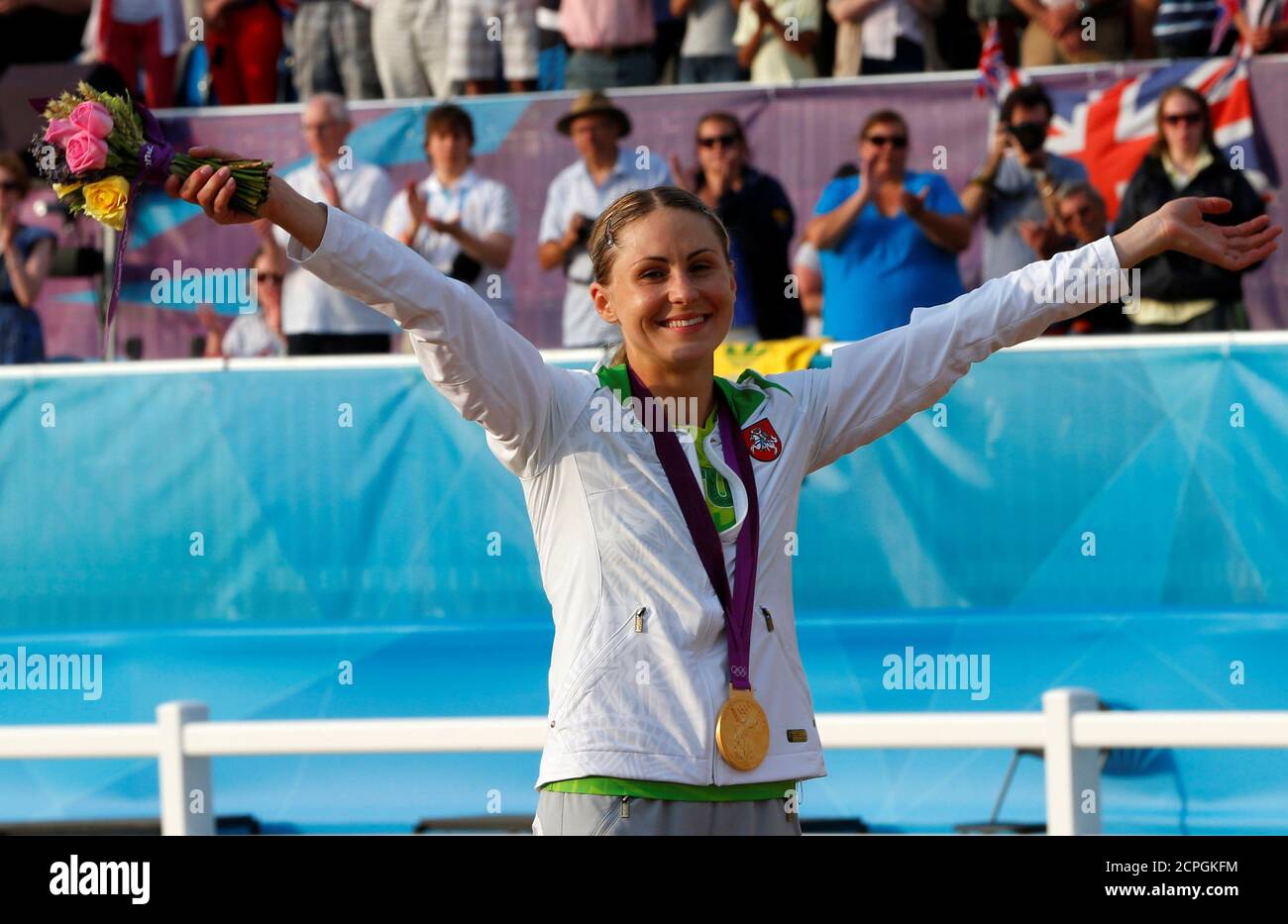 Lithuania's Laura Asadauskaite celebrates as she receives her gold medal during the victory ceremony for the women's modern pentathlon during the London 2012 Olympic Games August 12, 2012.     REUTERS/Mike Hutchings/File Photo Stock Photo