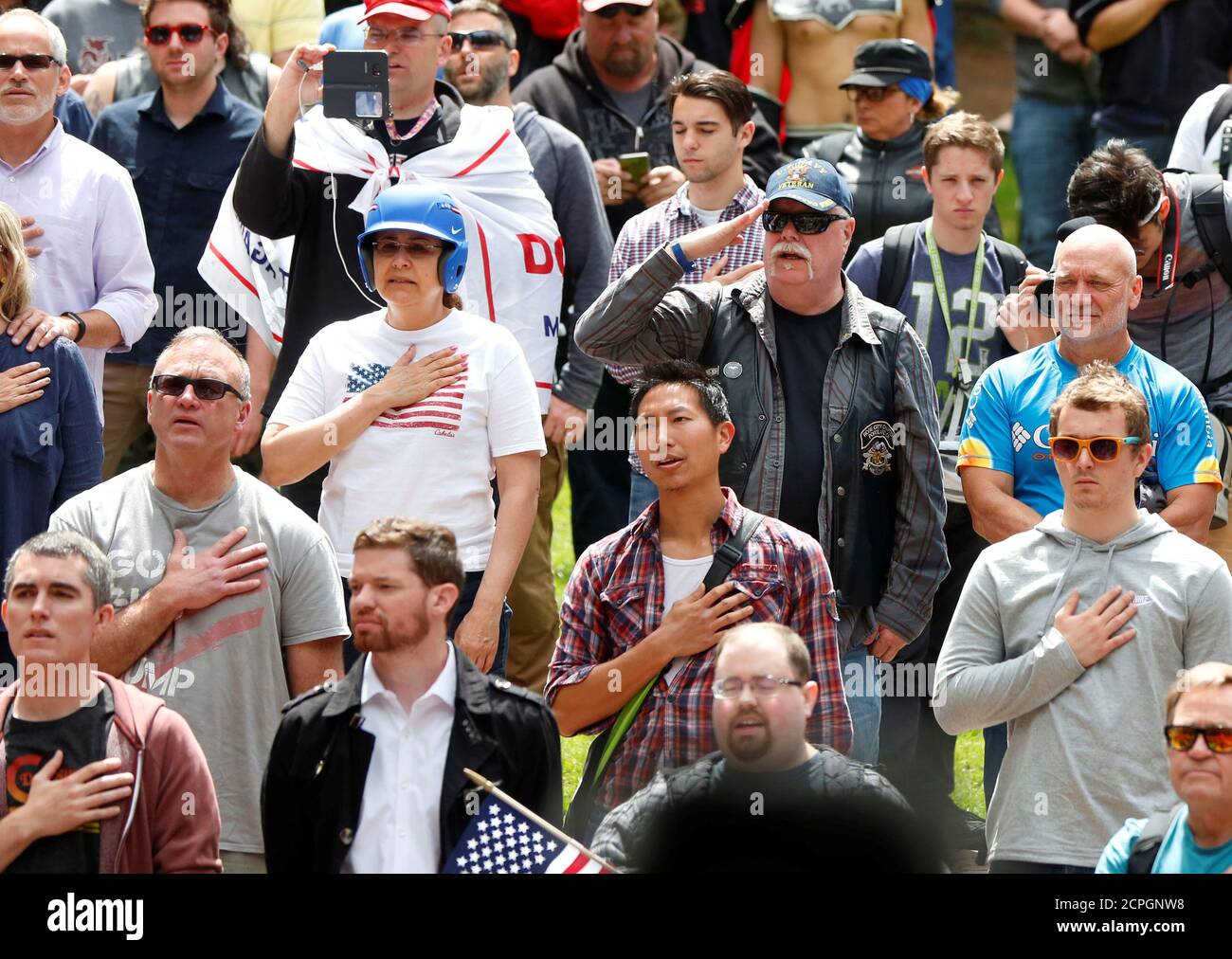 Conservative protesters recite the National Anthem during competing demonstrations in Portland, Oregon, U.S. June 4, 2017.  REUTERS/Jim Urquhart Stock Photo