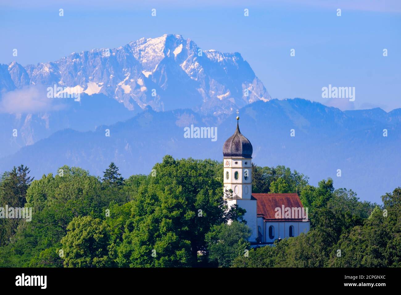 Church of St. Johann in Holzhausen on the Starnberger See, near Münsing, in the back the Zugspitze, Fünfseenland, Alpine foothills, Upper Bavaria, Bav Stock Photo