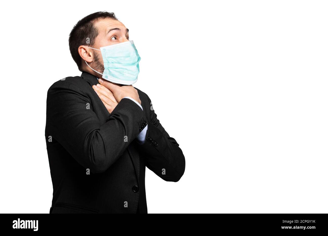 Man choking due to the lack of air isolated on white and wearing a mask, coronavirus concept Stock Photo