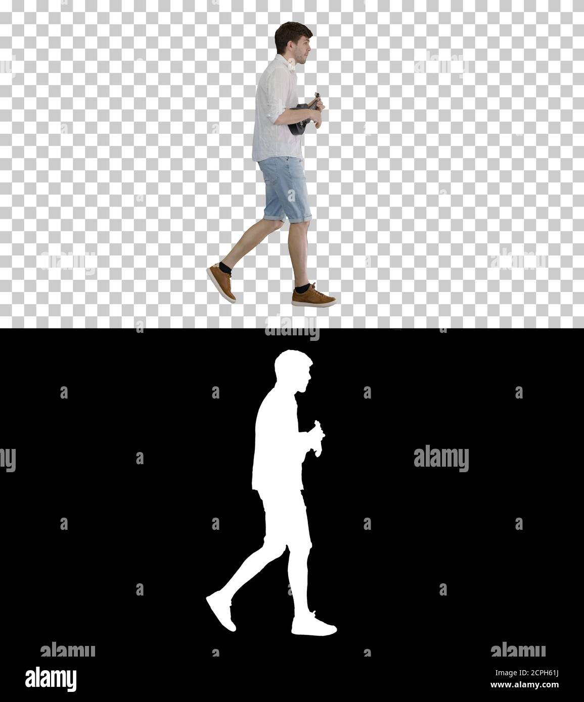 Young man playing ukulele while walking, Alpha Channel with Silh Stock Photo