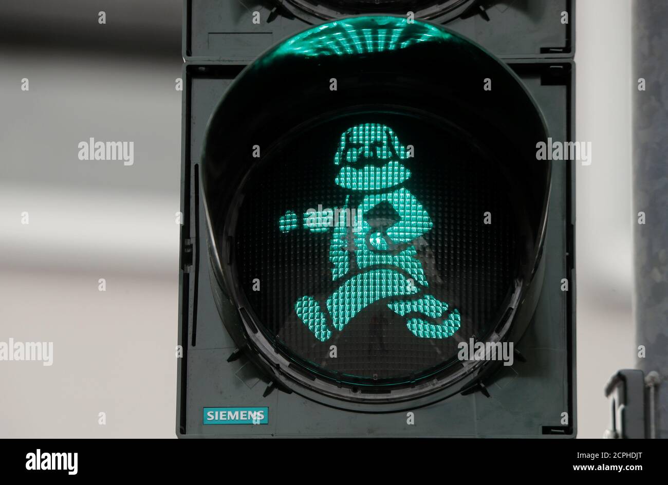 An image of German philosopher Karl Marx is seen in a traffic light for passengers in his hometown in Trier, Germany, April 13, 2018.   REUTERS/Wolfgang Rattay Stock Photo