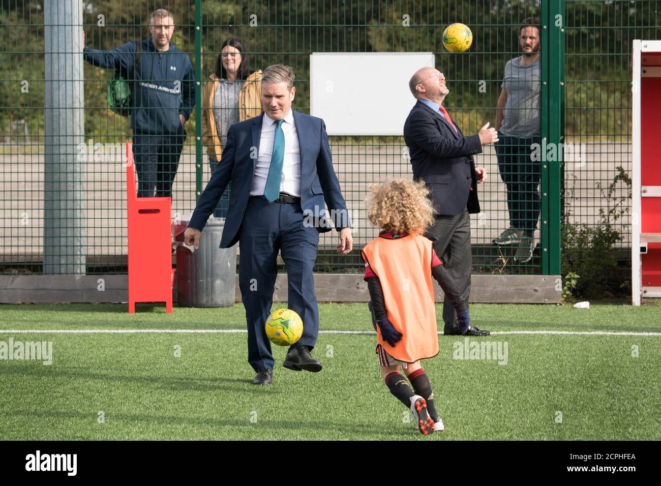 Labour Leader Sir Keir Starmer (left) with MP Liam Byrne playing football during a visit to Walsall football club to learn about their community work during the pandemic and discuss efforts to reopen sports stadiums in a Covid-secure way. Stock Photo