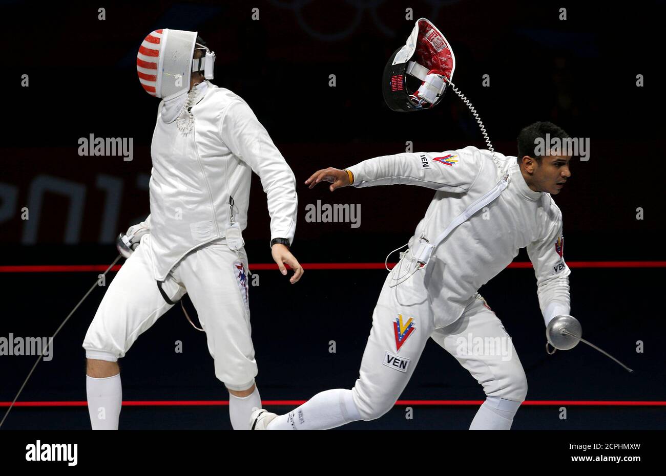 Venezuela's Ruben Limardo Gascon (R) reacts as he beats Seth Kelsey of the  U.S. at the end of their men's epee individual semifinals fencing  competition at the ExCel venue during the London