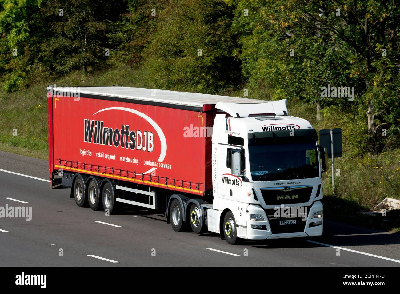 A Willmotts articulated lorry on the M40 motorway, Warwickshire, UK Stock Photo