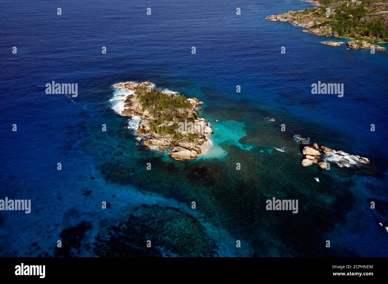 Aerial panorama of the Marine reserve of Coco island with the blue Indian Ocean, Seychelles