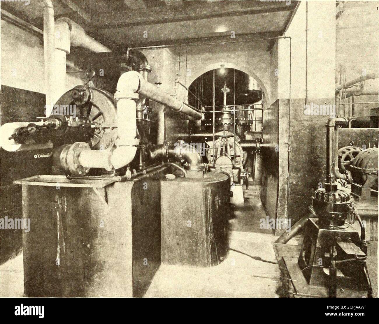. Electric railway journal . x 15 in. The boilers are ordinarily operated banked, thesteam pressure in four being kept at 150 lb., one being runat from 100 to 125 lb., and the sixth without fires. Thedraft gages are of the Ellison differential type. The feedwater is admitted to the boilers at a temperature of from200 to 210 deg. Fah. ENGINE ROOM The operating room of the station is about 24 ft. wide x67 ft. long, and is divided into a raised section containingan 8000-kva Westinghouse-Parsons 4400-volt, three-phase, revolving field turbo-alternator, operating at 1800r.p.m., and a lower bay or a Stock Photo