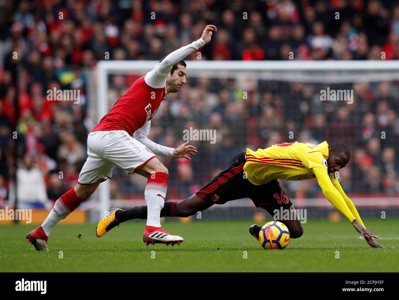Soccer Football - Premier League - Arsenal vs Watford - Emirates Stadium, London, Britain - March 11, 2018   Arsenal's Henrikh Mkhitaryan in action with Watford's Abdoulaye Doucoure          REUTERS/Eddie Keogh    EDITORIAL USE ONLY. No use with unauthorized audio, video, data, fixture lists, club/league logos or 'live' services. Online in-match use limited to 75 images, no video emulation. No use in betting, games or single club/league/player publications.  Please contact your account representative for further details. Stock Photo
